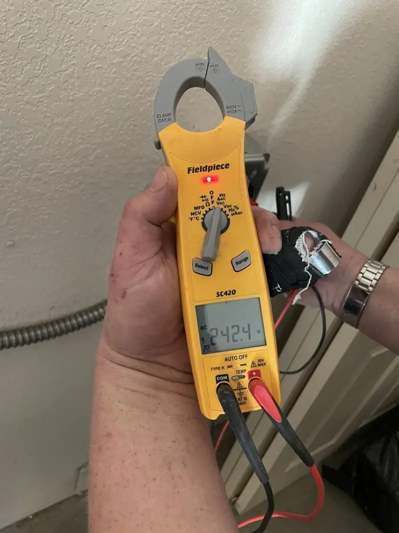 Voltage testing with clamp meter during Recessed Lighting Installation in Columbus